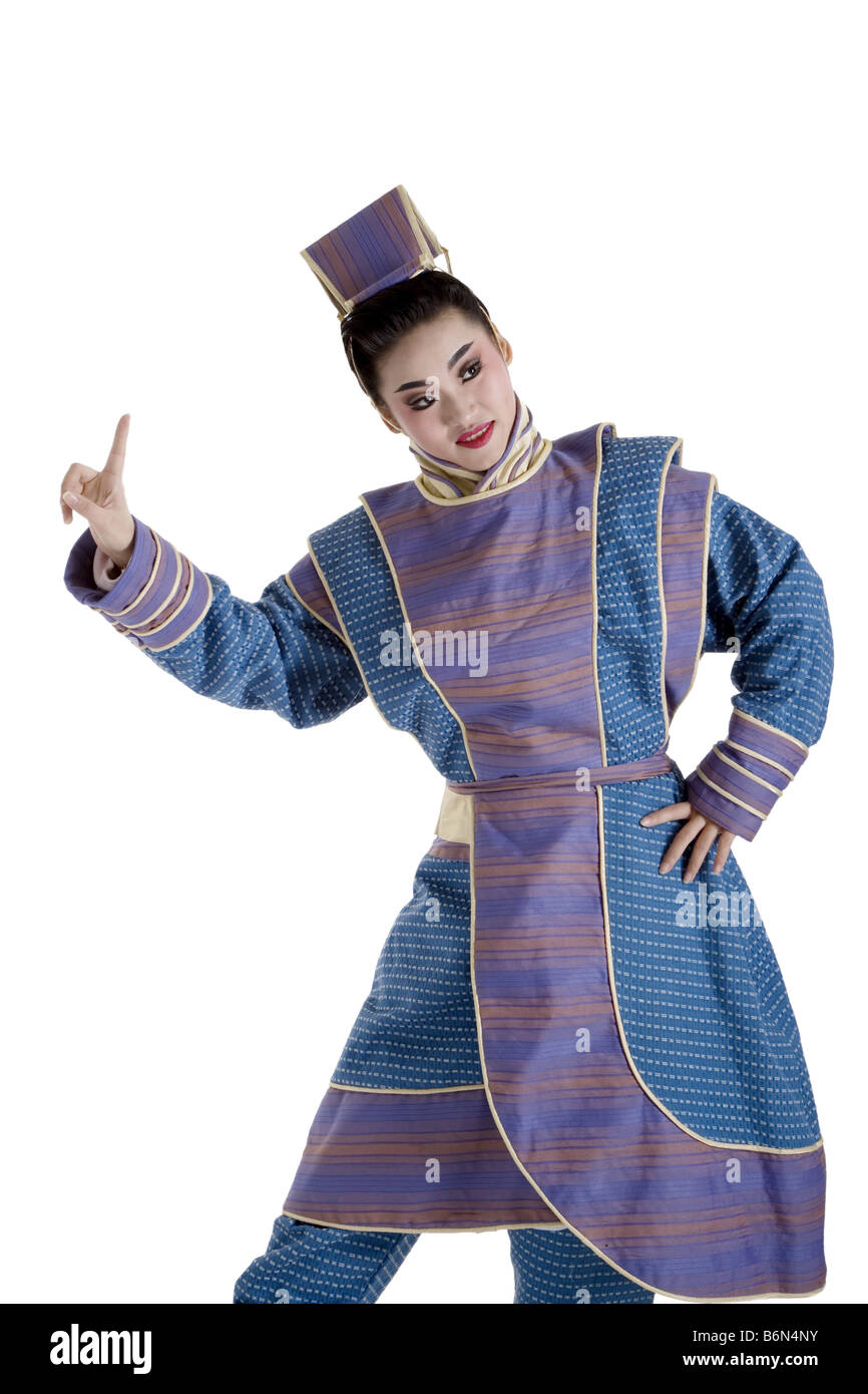 Portrait of a young man wearing traditional clothing pointing up Stock ...