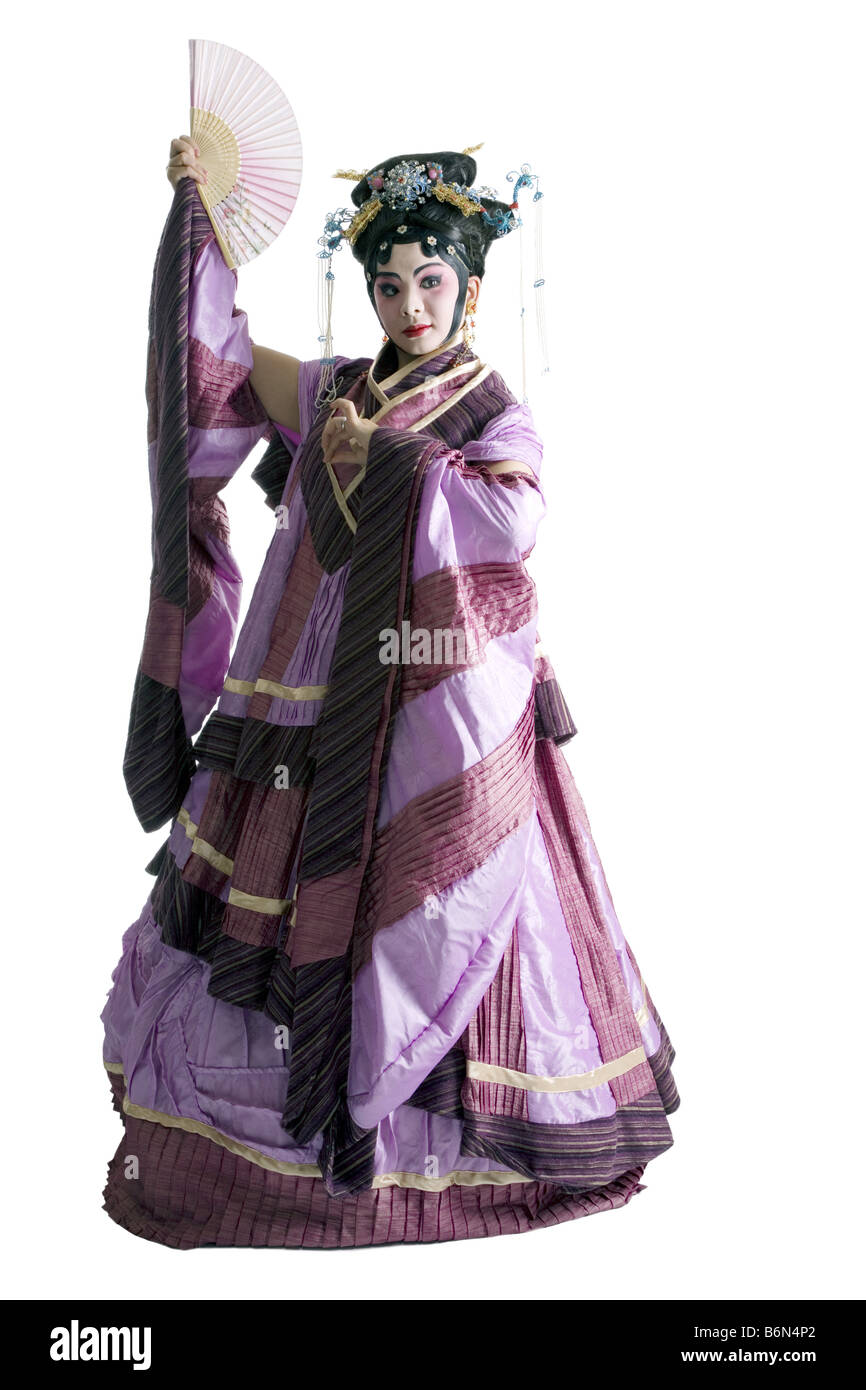 Mature woman with fan wearing traditional clothing Stock Photo