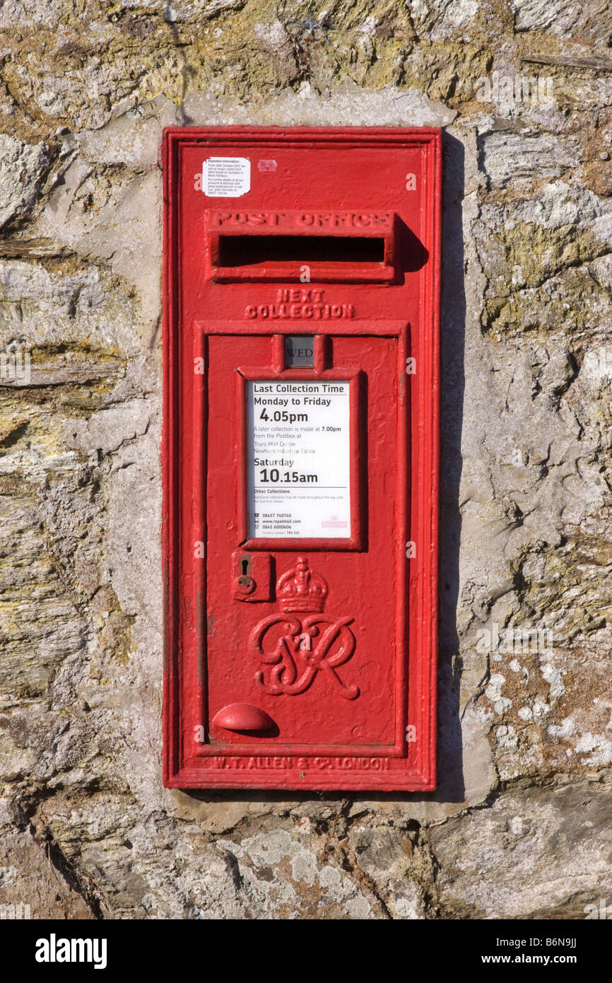 Letterbox in a stone wall in St Mawes, Roseland, Cornwall Stock Photo