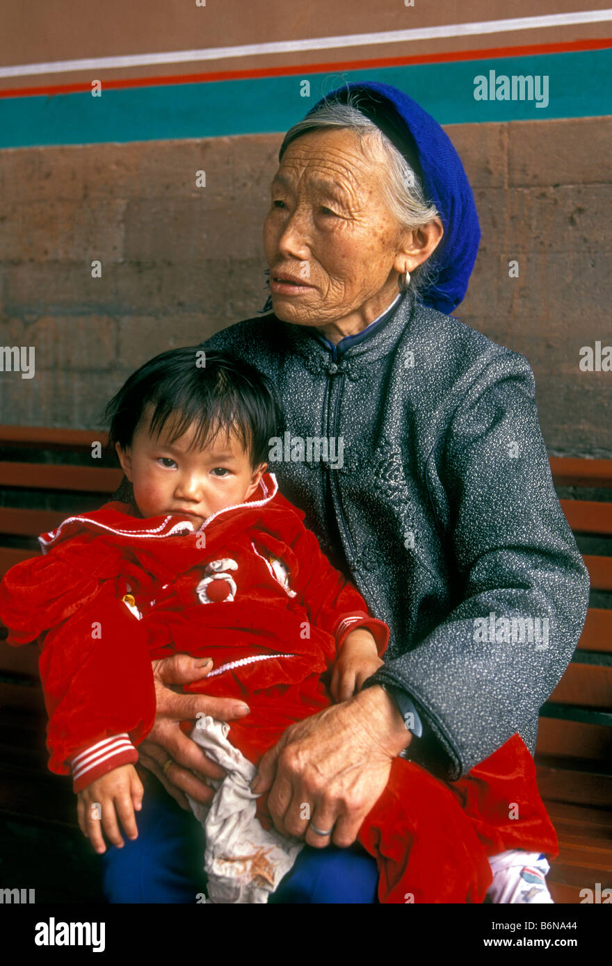 Chinese woman, old woman, elderly woman, mature woman, senior citizen, holding, grandson, male, child, grandchild, young boy, Beijing, China, Asia Stock Photo