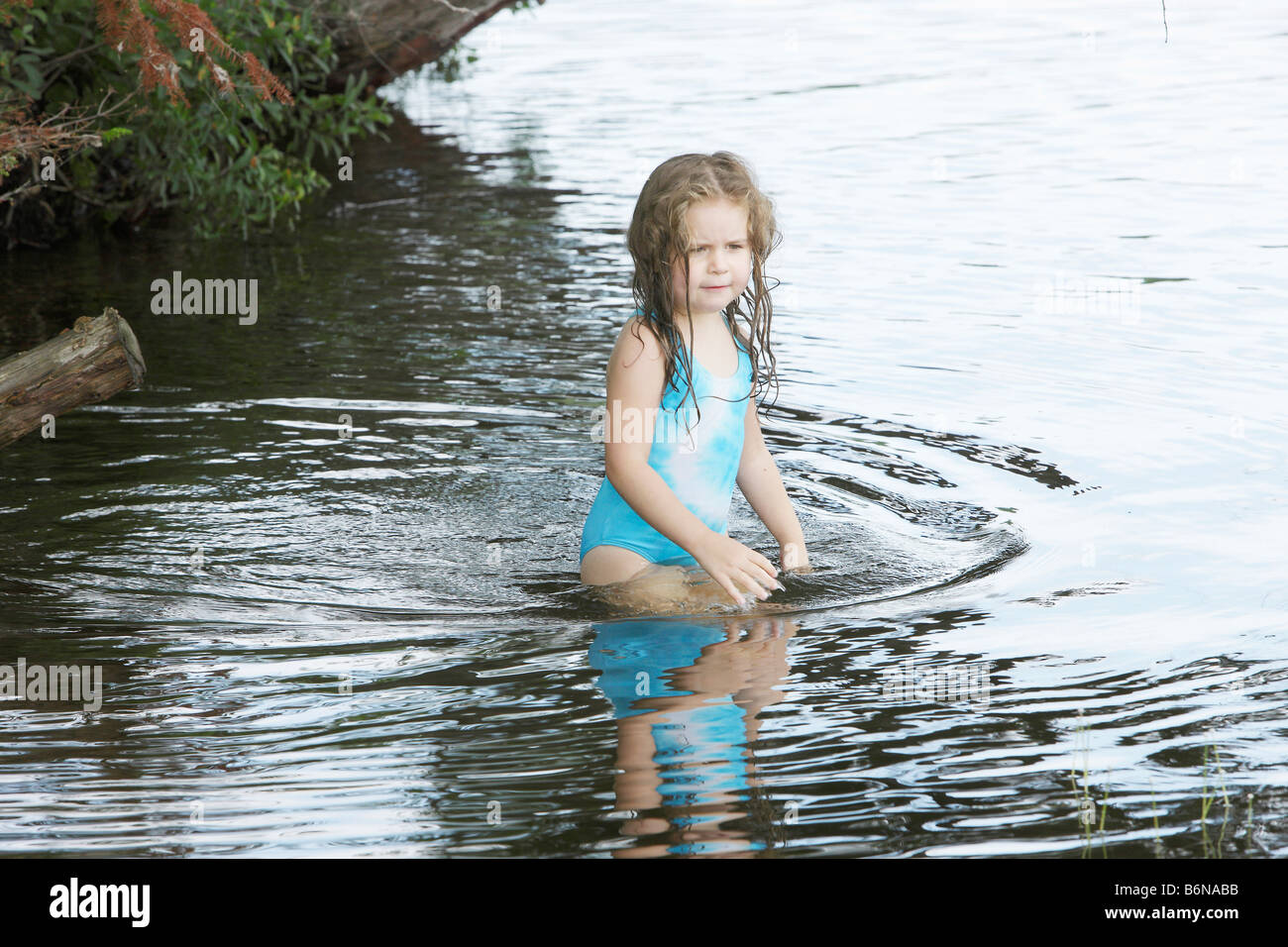 little girl wading in water Stock Photo - Alamy