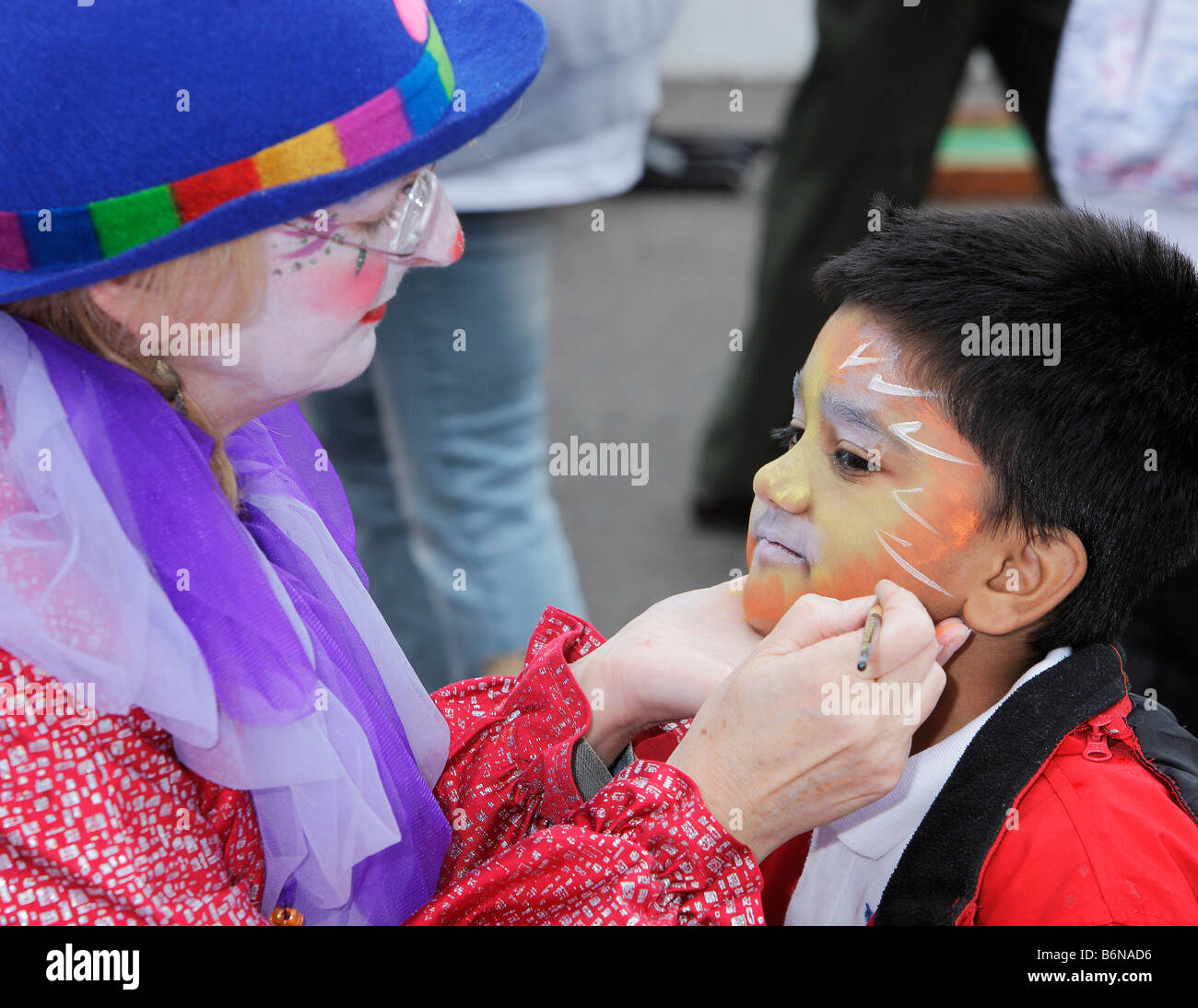 Child with clown face painting hi-res stock photography and images - Alamy