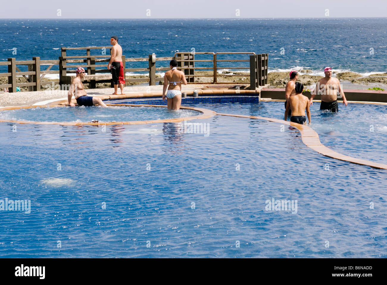 Taiwan, Tourists Enjoying Green Island Jhaorih Saltwater Hot Springs Pool Stock Photo