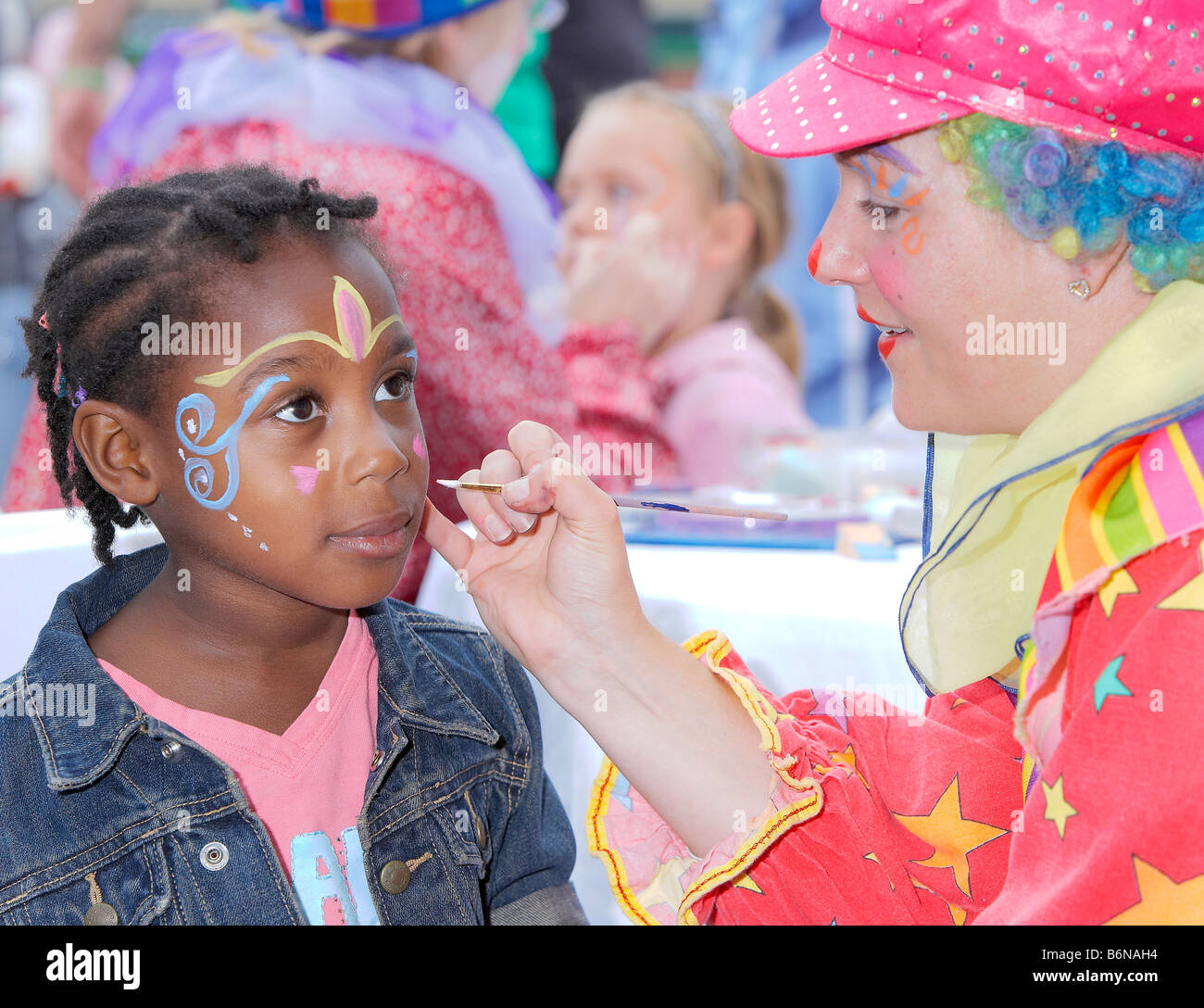 Child with clown face painting hi-res stock photography and images - Alamy