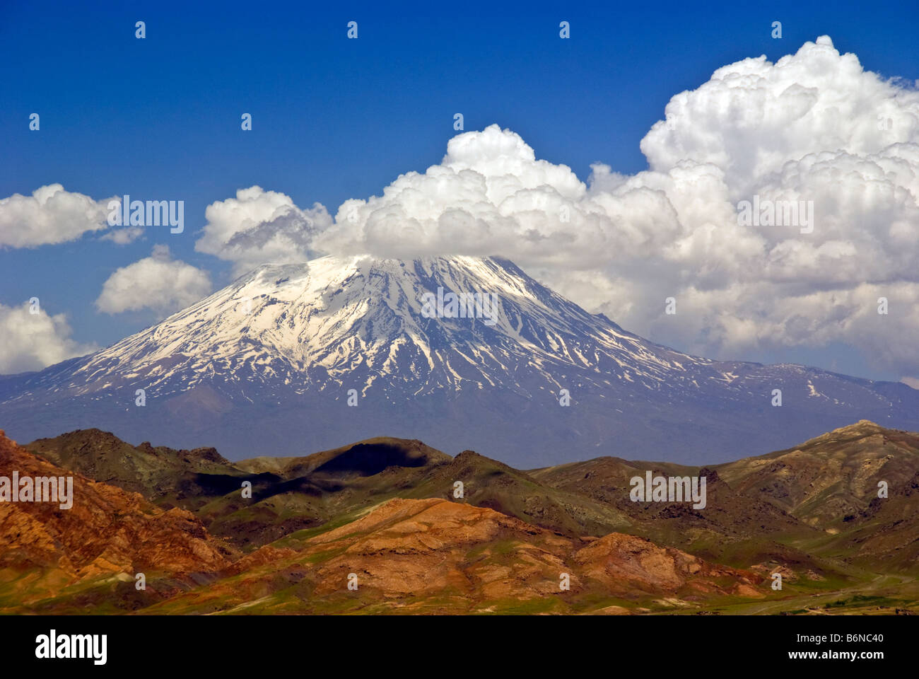 Mt. Ararat, snow capped dormant volcano and site of Noah Biblical story, partially obscured by clouds Stock Photo
