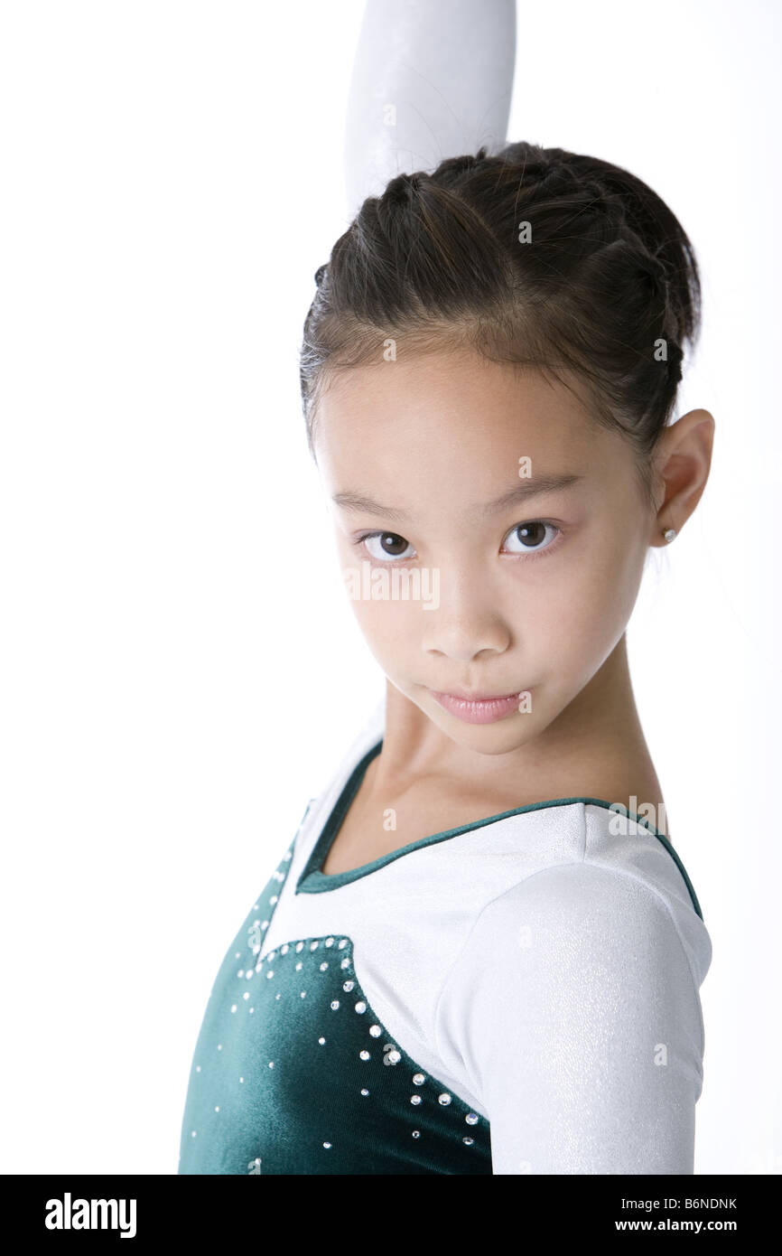 Girl wearing tracksuit posing side view Stock Photo Alamy