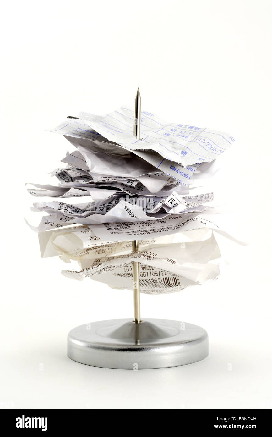 Receipts on metal spike Stock Photo Alamy