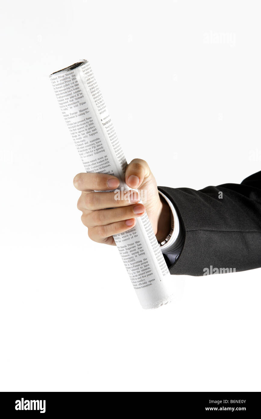 Man holding roll made from newspaper Stock Photo - Alamy