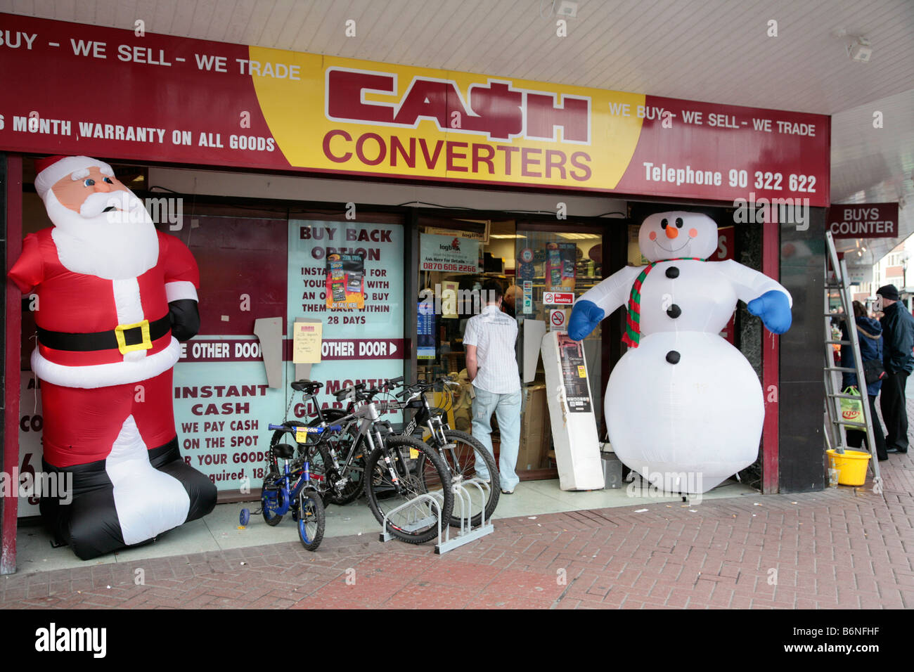 front of a cash converters shop at christmas on a uk high street belfast Stock Photo