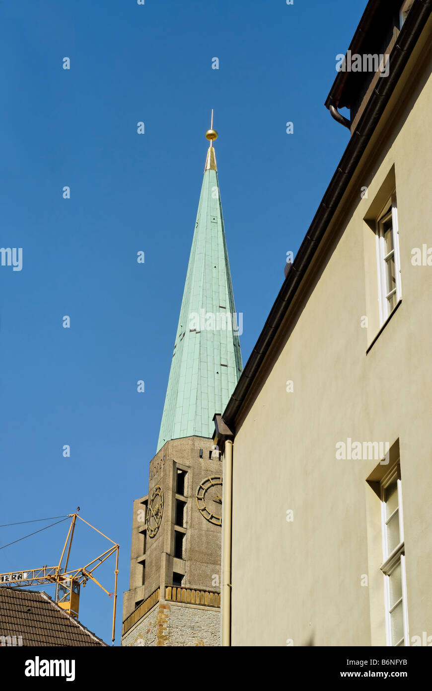 View of the Bielefeld street and the broach spire of the Nikolai church Altstädter Nicolaikirche Bielefeld Germany Stock Photo