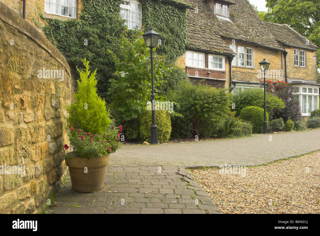 Cotswold cottages on the approach to the Cotswold Motor Museum