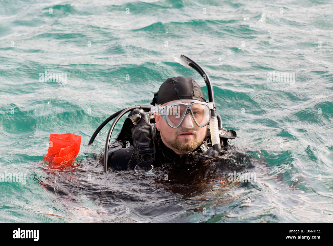 Man In Scuba Diving Equipment On Ocean Surface, Taiwan, Green Island