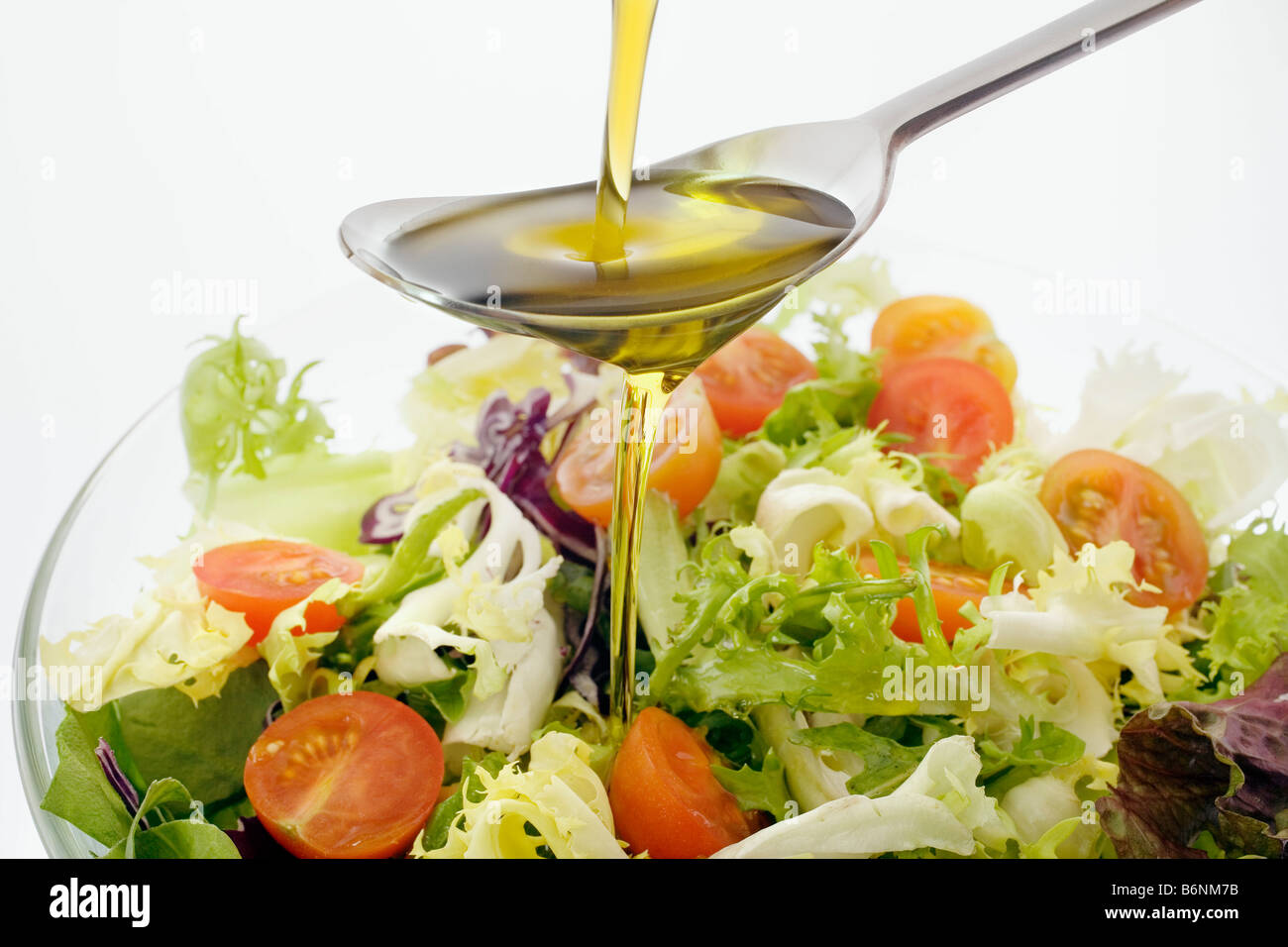 Extra virgin olive oil and salad typical of the Mediterranean diet aceite de oliva virgen extra ensalada dieta mediterranea Stock Photo