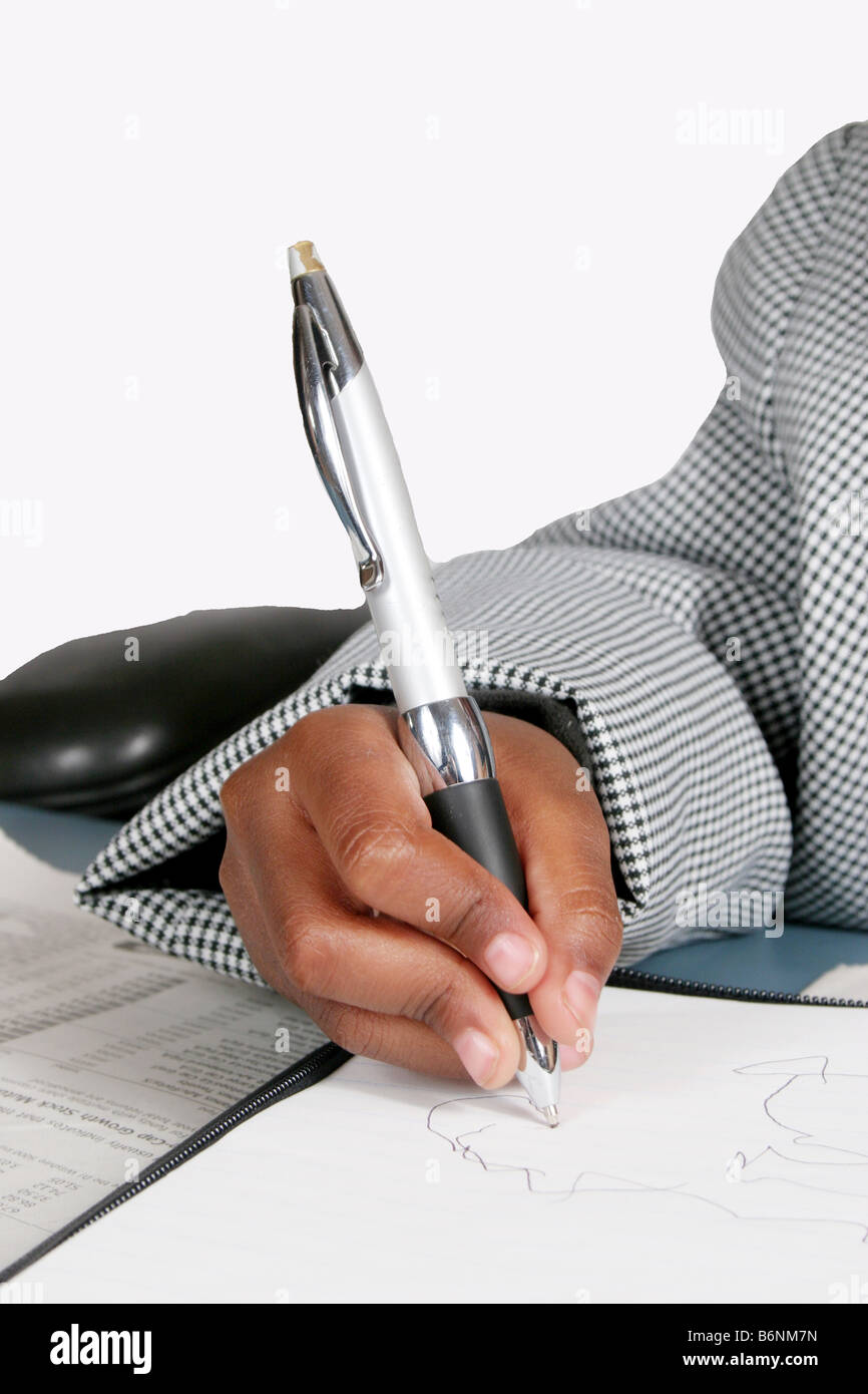 Young man writing with a pen Stock Photo - Alamy