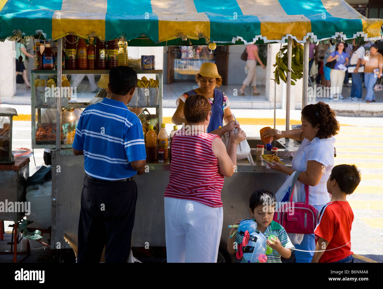 Food stall selling fried plantain Plaza del Independencia Merida Mexico Yucatan Stock Photo