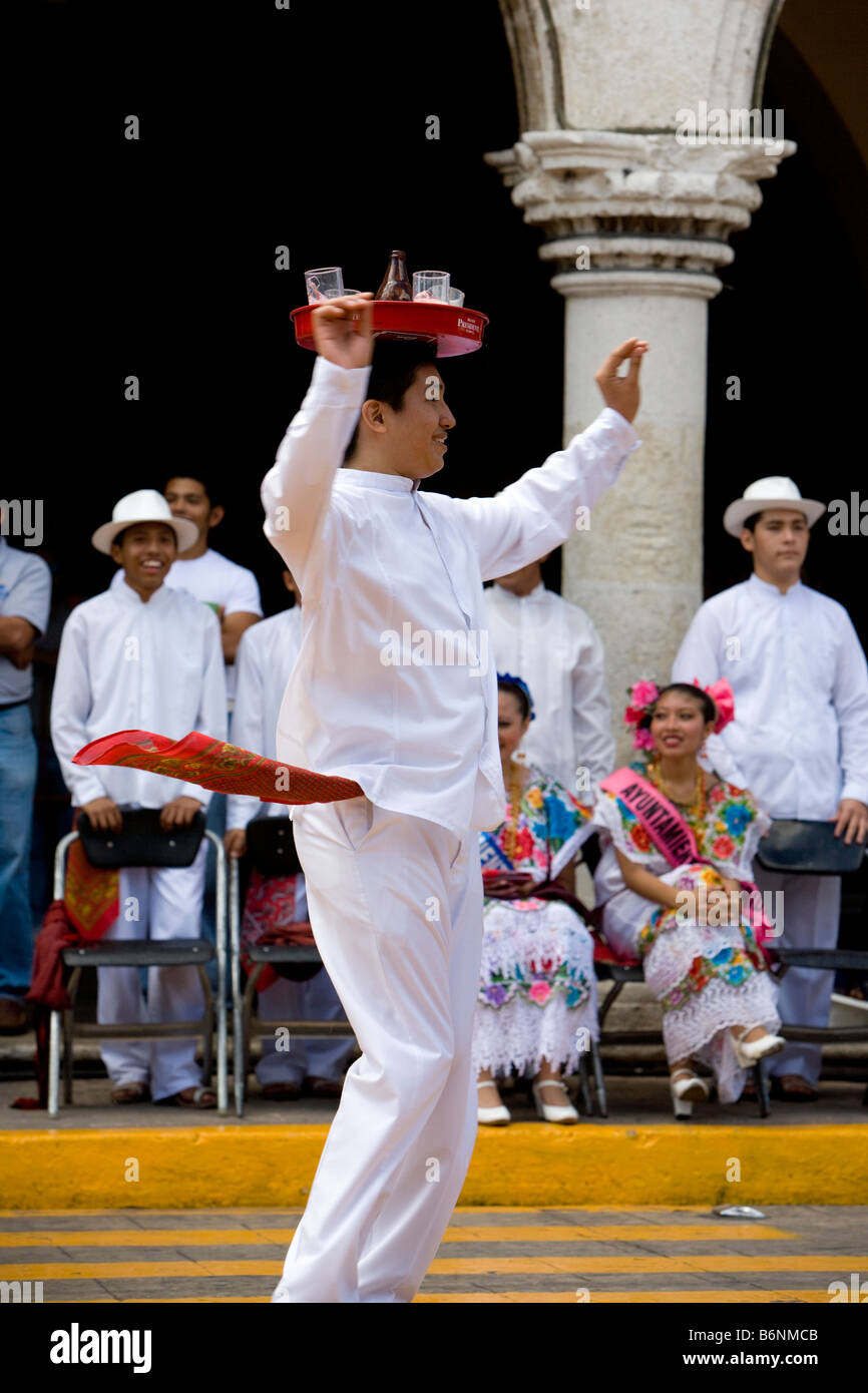 Traditional Mexican Folk Dancing display with beer and trays on heads Merida Yucatan Mexico Stock Photo