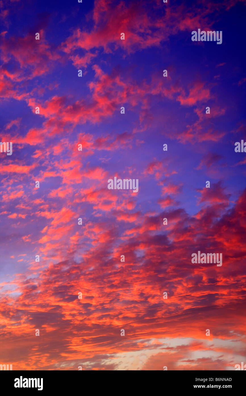 Sunset Colours Stratocumulus Pattern Clouds weather forecast sky fluffy clouds dusk dawn Cloud formations global warming nature Stock Photo