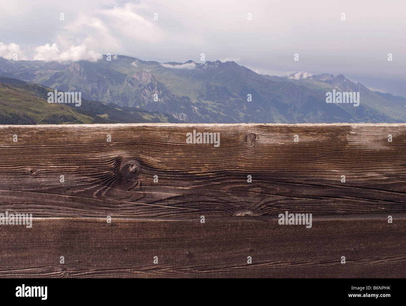 wooden barrier and mountain range Stock Photo