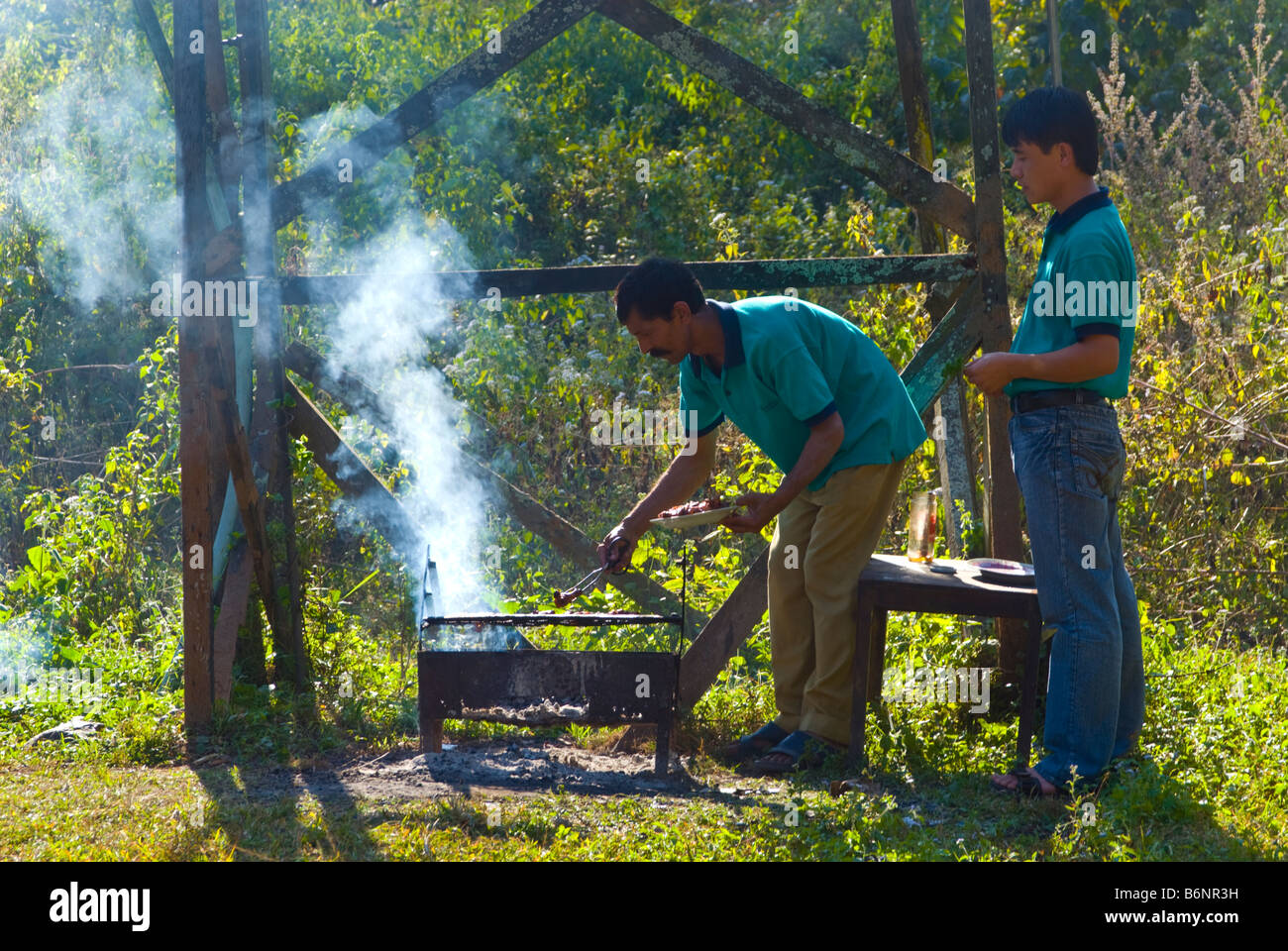 Staff at Glenburn Tea Estate, Darjeeling, India, prepare a barbeque for guests. Stock Photo