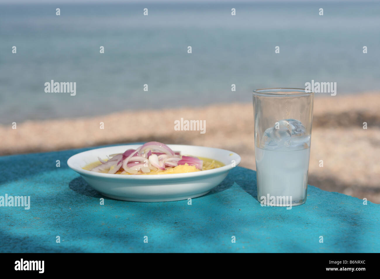 greek traditional food fava with glass of ouzo by the sea Stock Photo