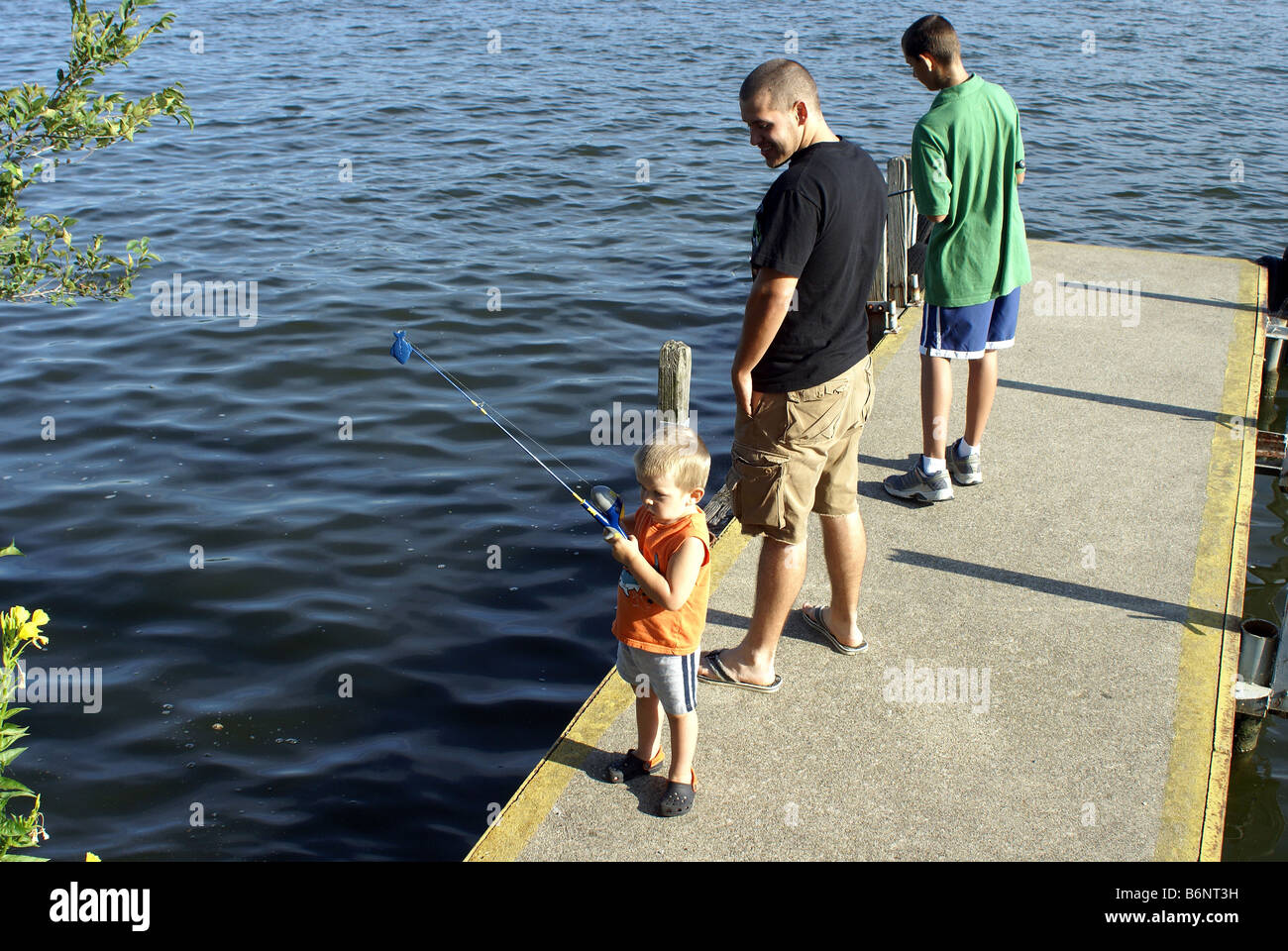 Watching Toddler Fishing Stock Photo