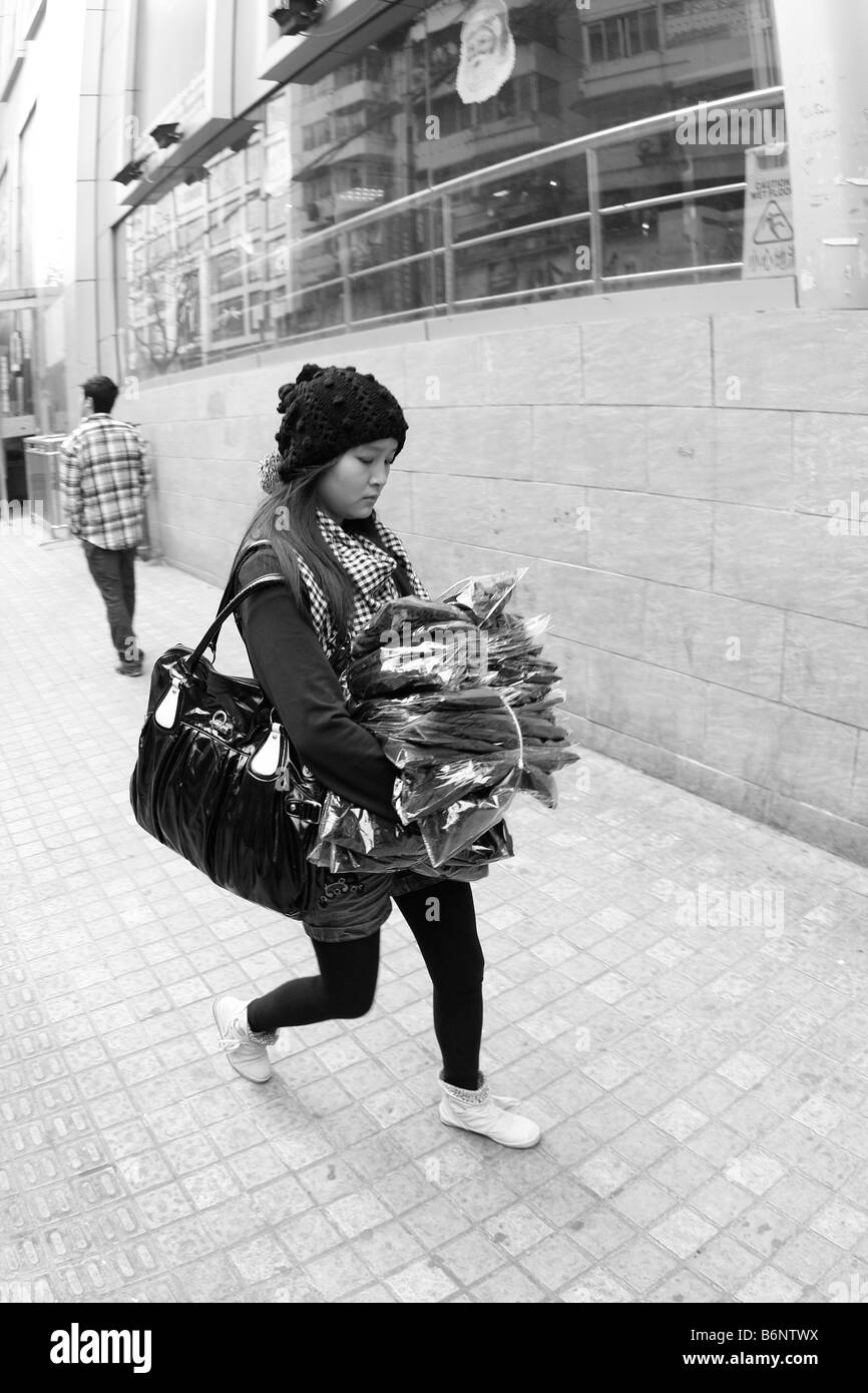 This young lady is one of the many who are also feeling the stress If you come early all the streets are filled with endless lin Stock Photo