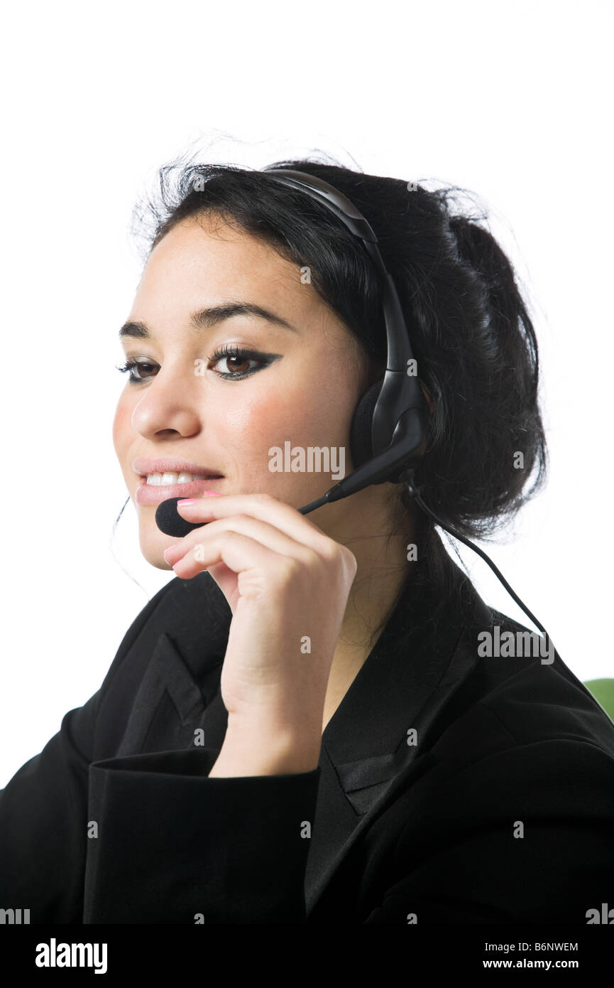 Pretty young call service representative against white Stock Photo - Alamy