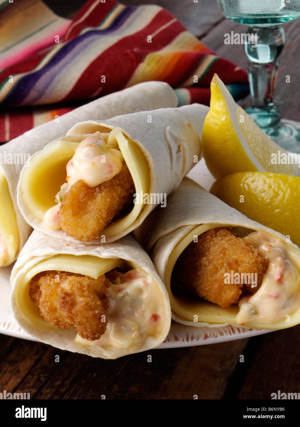 Tortilla wrapped lemon sole goujons Stock Photo Alamy