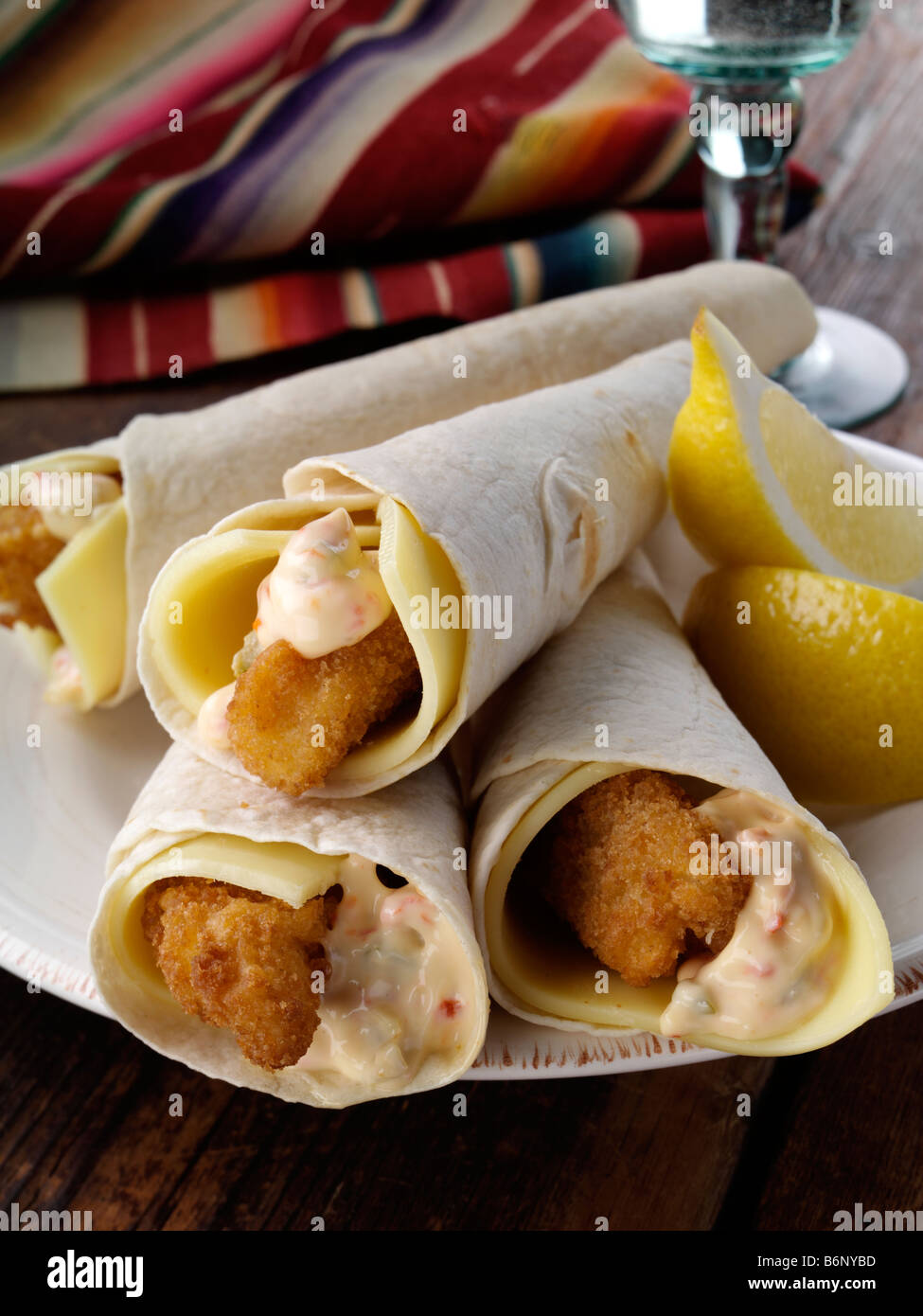 Tortilla wrapped lemon sole goujons Stock Photo Alamy