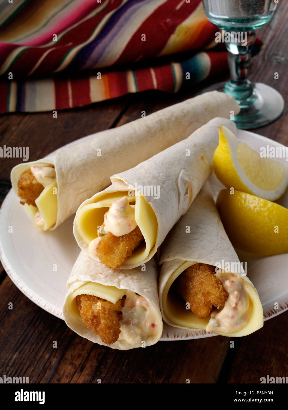 Tortilla wrapped lemon sole goujons Stock Photo Alamy