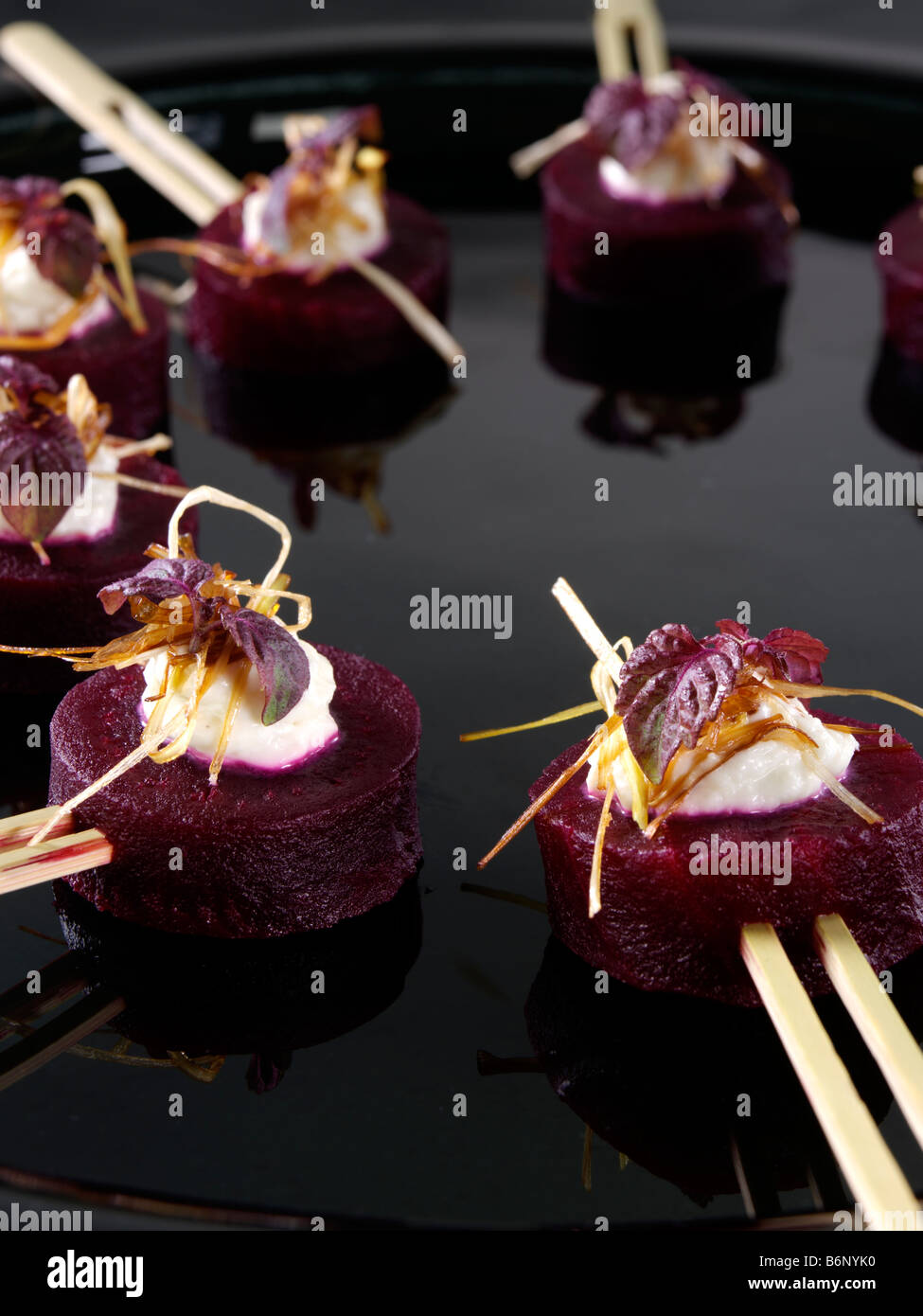 Roasted beetroot canapes horseradish cream crispy leeks Stock Photo Alamy