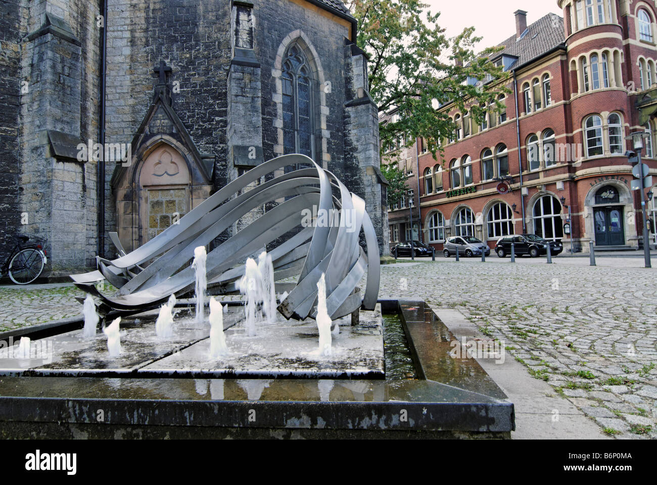 City fountain in front of the old church building Bielefeld Germany Stock Photo