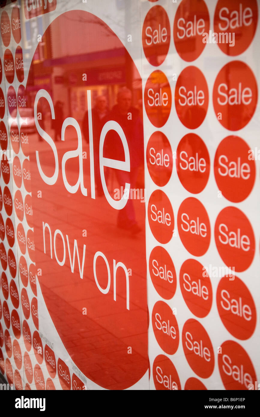 A sign in a shop window announces the start of the January sales Stock