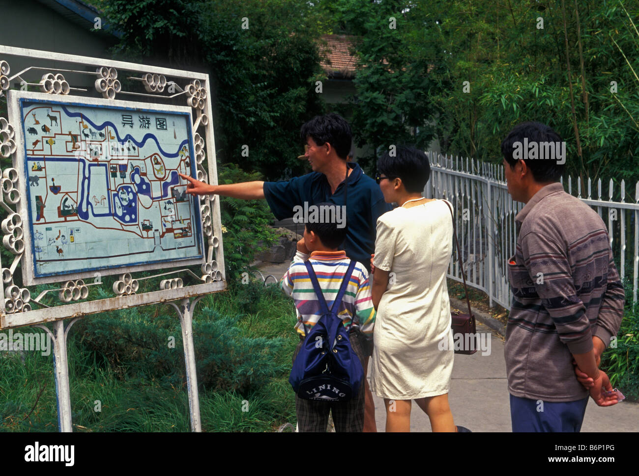 Chinese people, Chinese family, father, mother, son, tourists, visitors, looking at map, zoo, Beijing, Beijing Municipality, China, Asia Stock Photo
