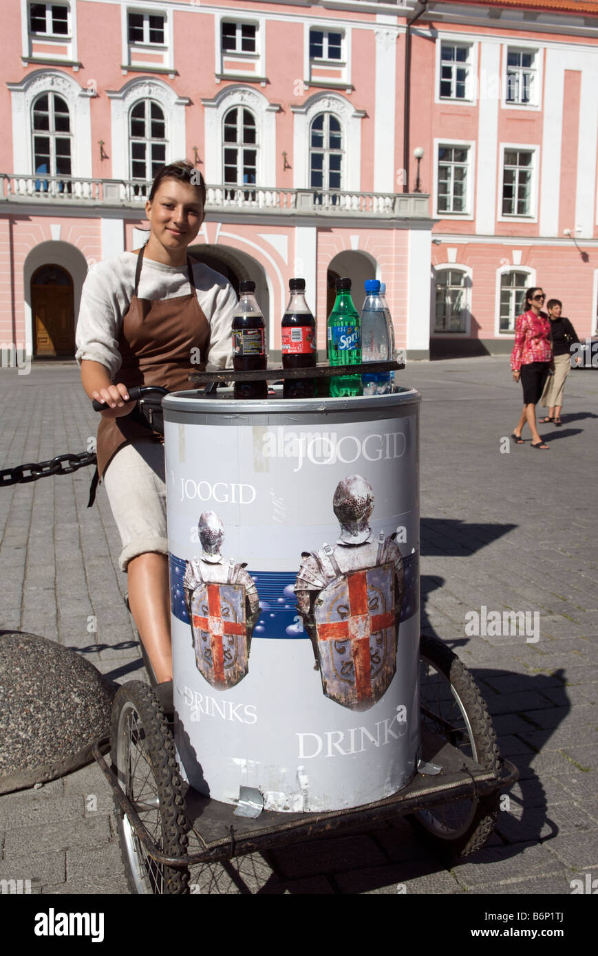 Pretty girl selling cold soft drinks on tricycle outside Toompea Castle Tallinn Estonia Stock Photo