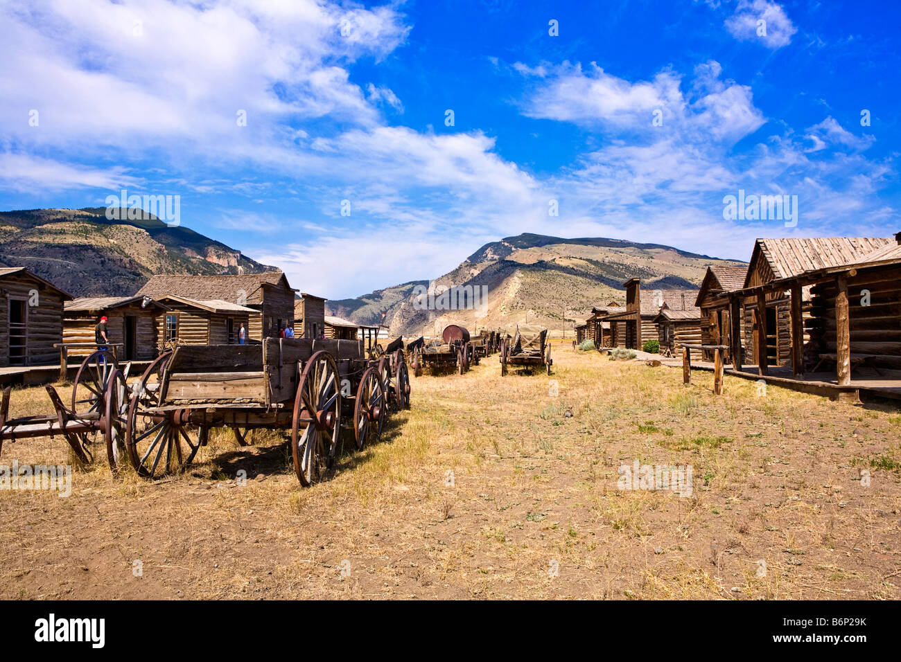 Stock photo looking down the main street of Old Trail Town Wyoming with some horse drawn vehicles abandoned Stock Photo