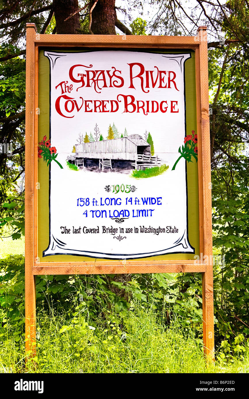 Image of the Grays River Covered Bridge Welcome Sign as it stands beside the bridge in Washington State Stock Photo