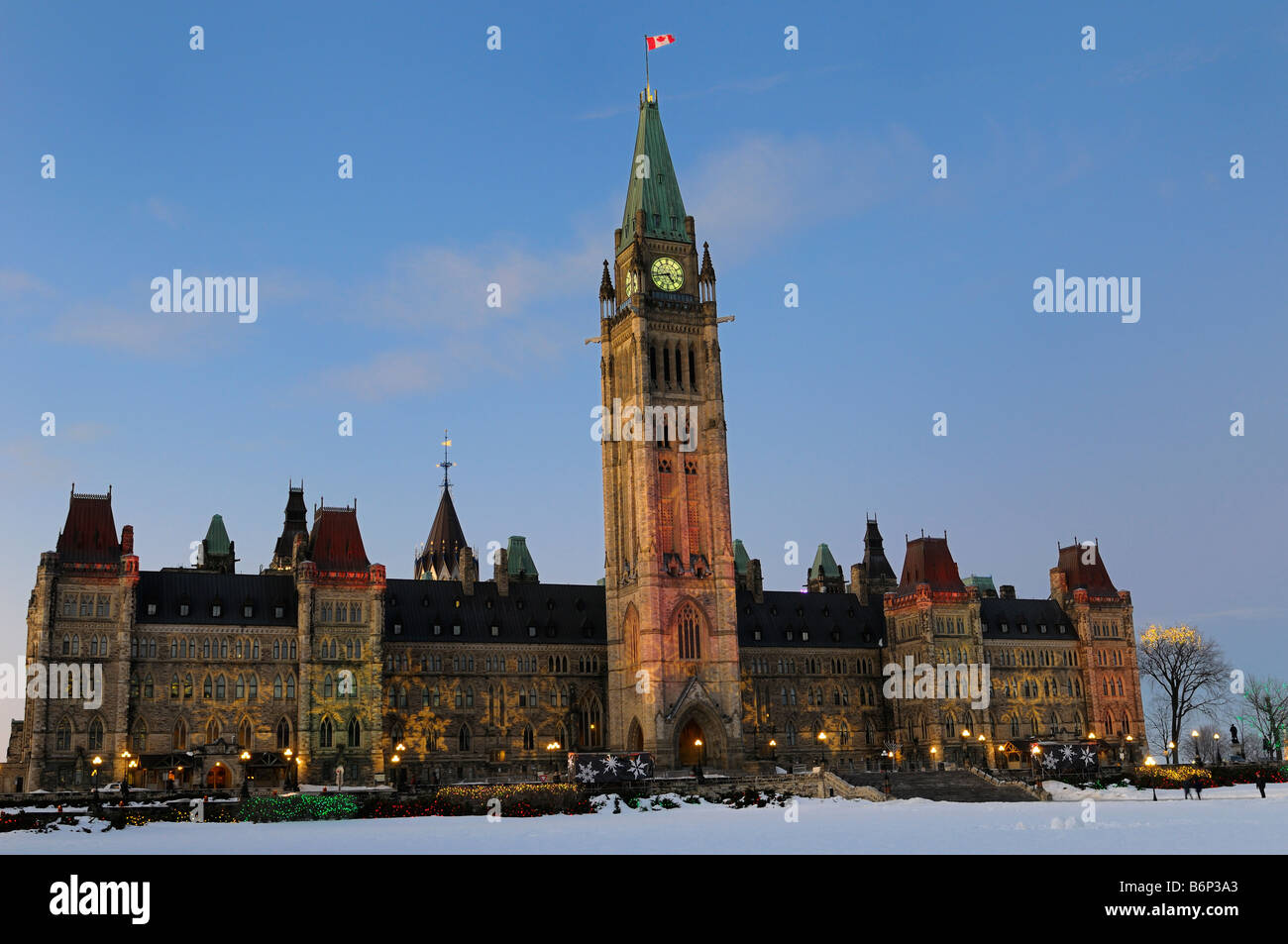 Ottawa Parliament Buildings center Block with Peace Tower at Parliament Hill government of Canada Christmas Lights at sundown Stock Photo
