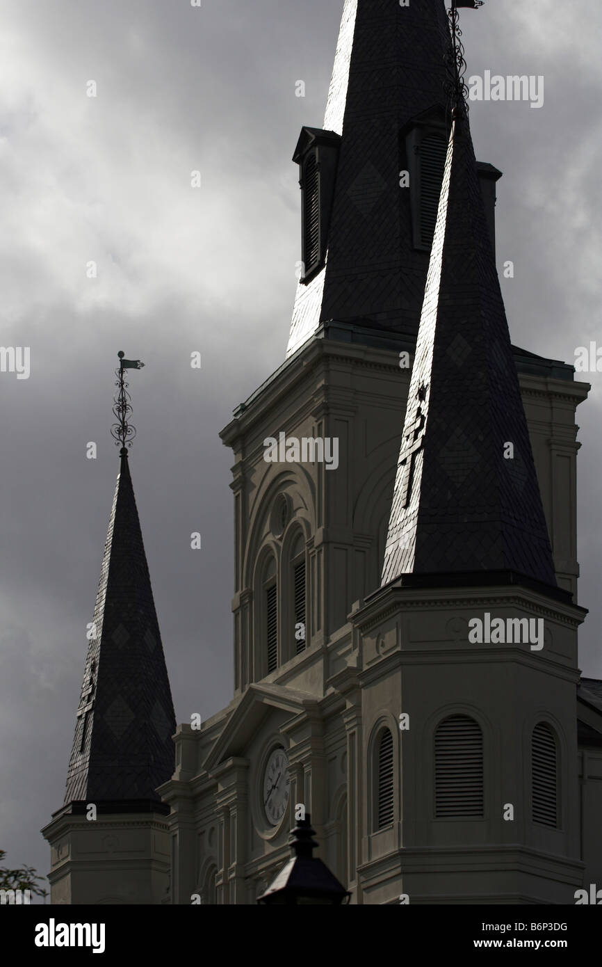 The light breaks through the clouds onto the steeples of St. Louis Cathedral in the French Quarter. New Orleans, Louisiana. Stock Photo