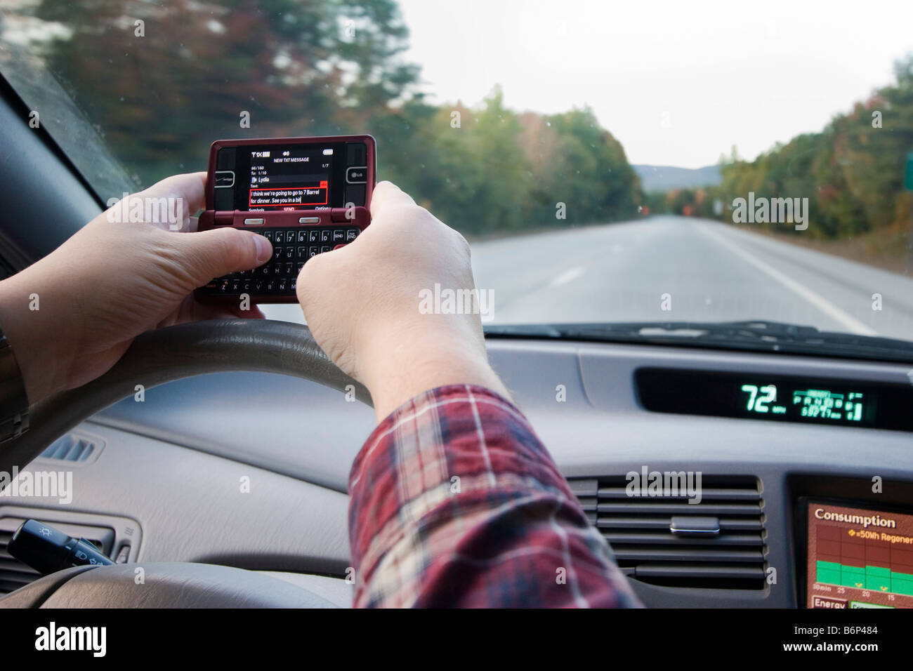Josh Fiedler of Royalton Vermont text messages his wife as he drives October 4 2008 Stock Photo