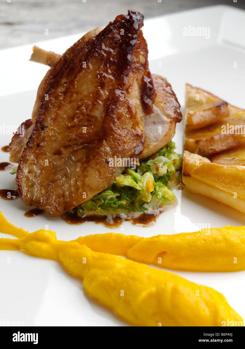 Picture of Roasted guinea fowl with parsnip tart fin carrot puree and jusgri Stock ...