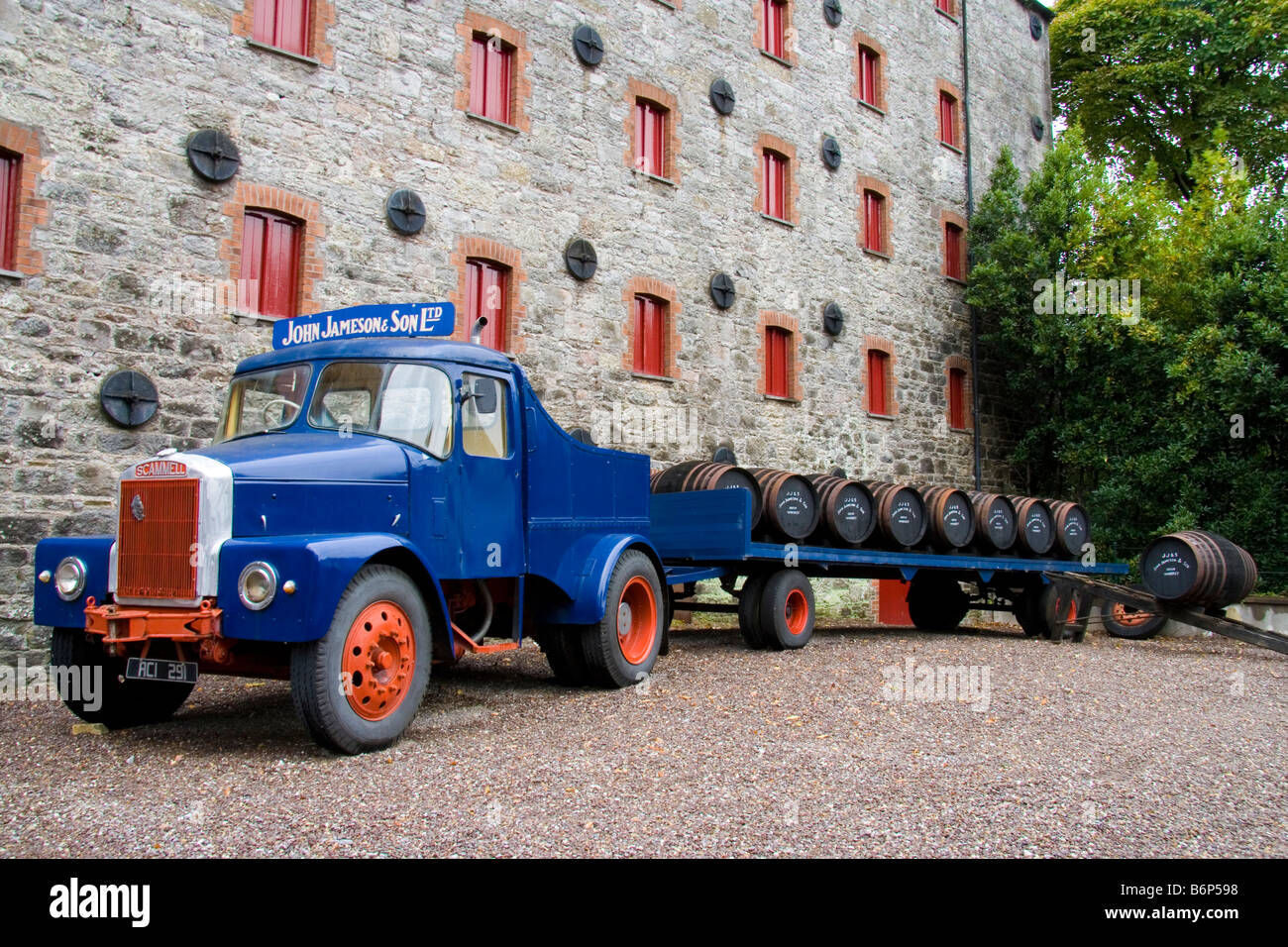 Old delivery truck laden with whiskey barrels on display outside the Jamesons Old Distillery at Midleton in County Cork, Ireland Stock Photo