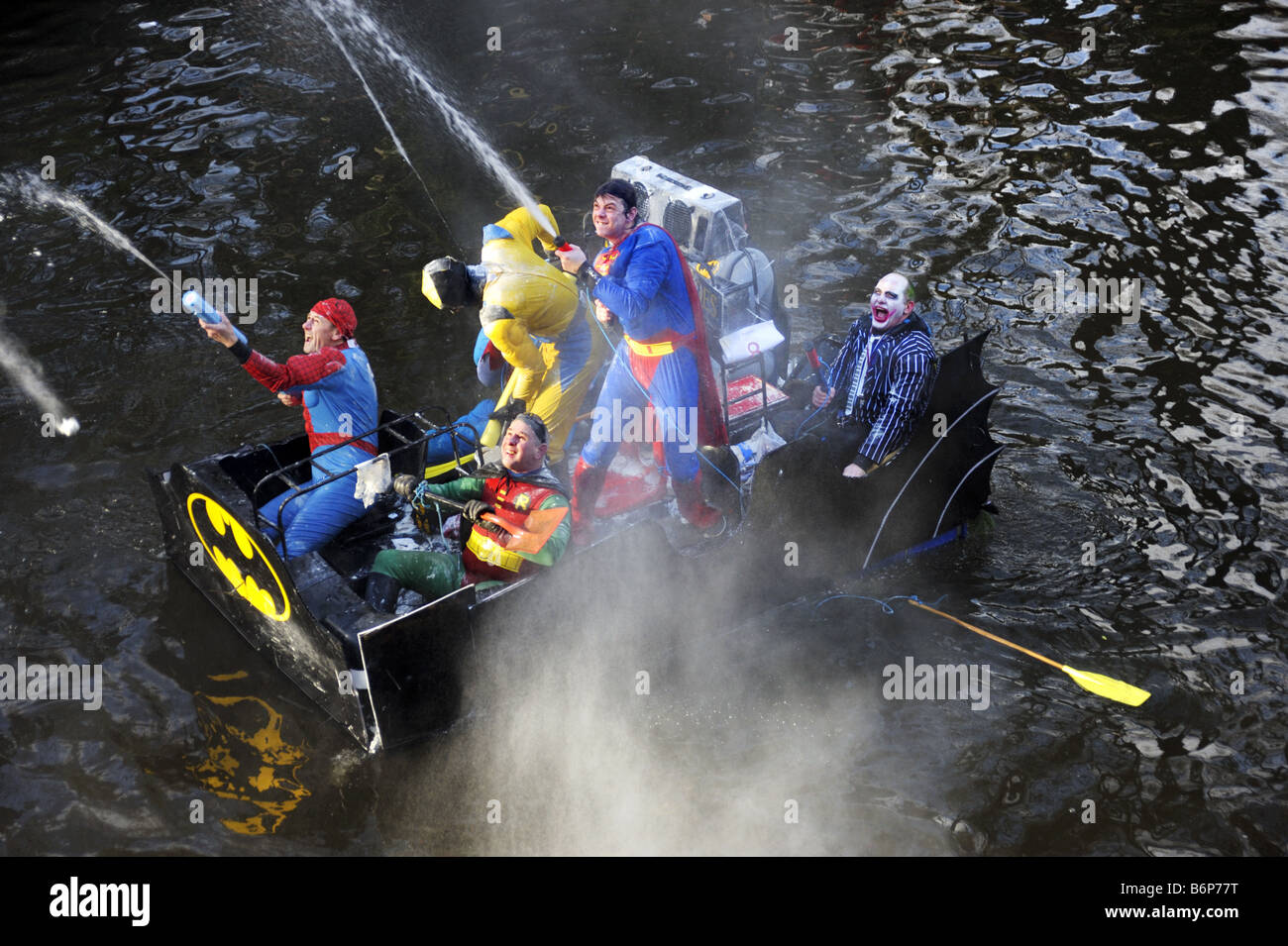 Superheroes raft in the annual Boxing Day Raft Race at Matlock Bath, Derbyshire Stock Photo
