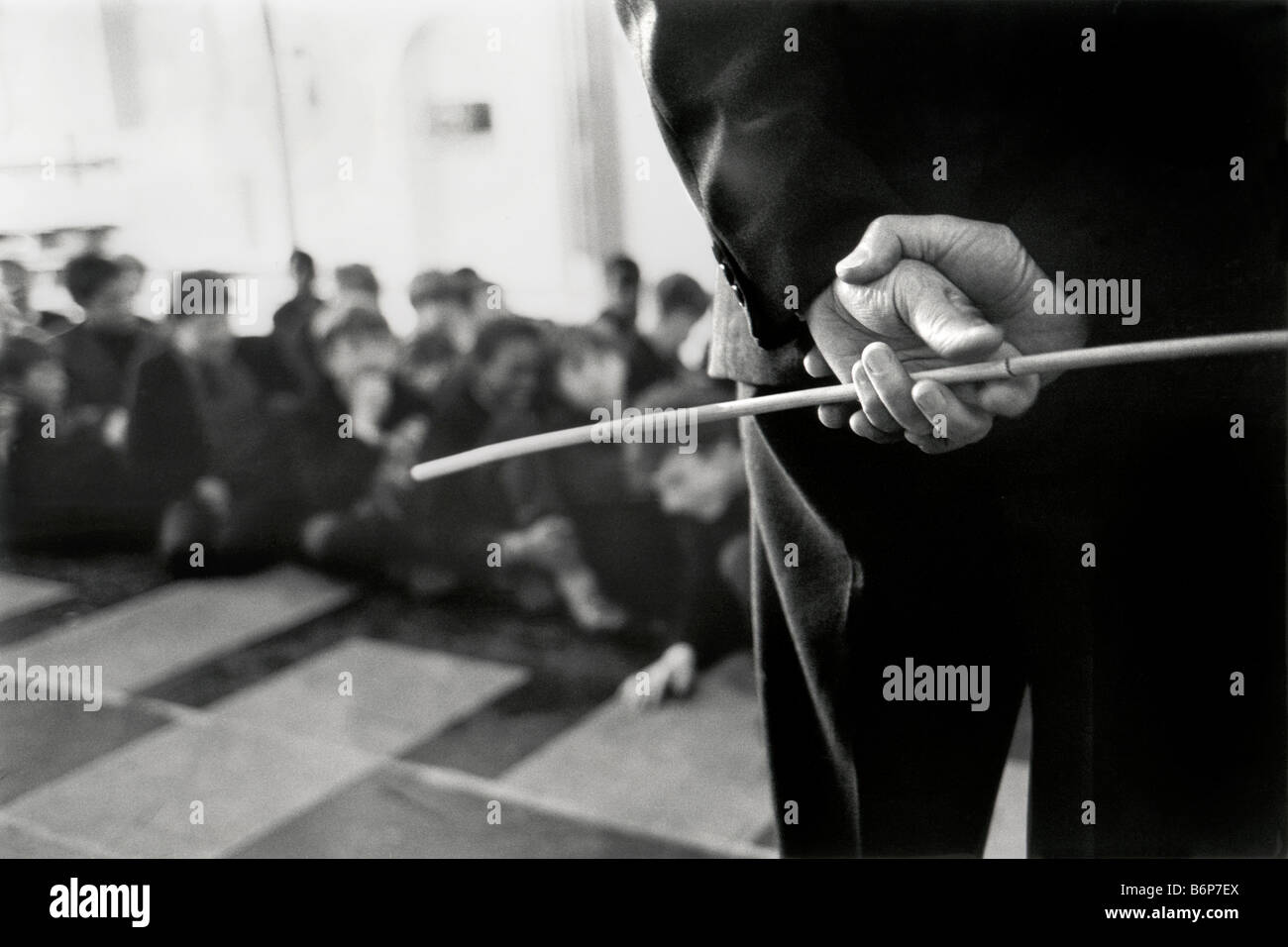 hands of teacher holding cane in the schoolclass Stock Photo