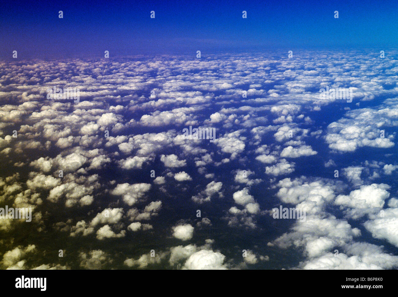 Aerial view of dramatic white clouds against a blue sky Stock Photo - Alamy