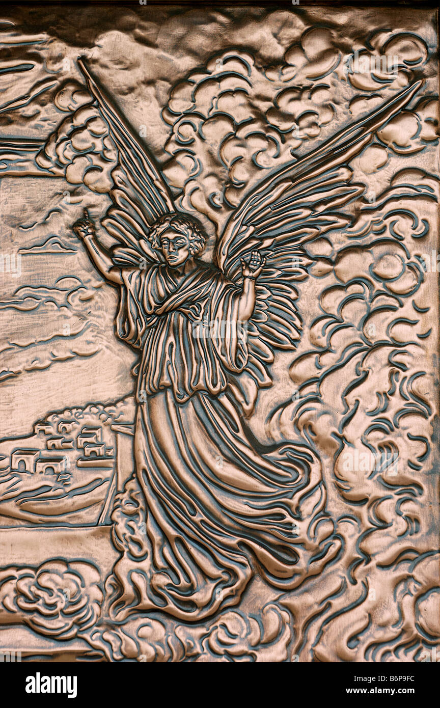 Biblical scenes in hammered copper on the doors of a cathedral in