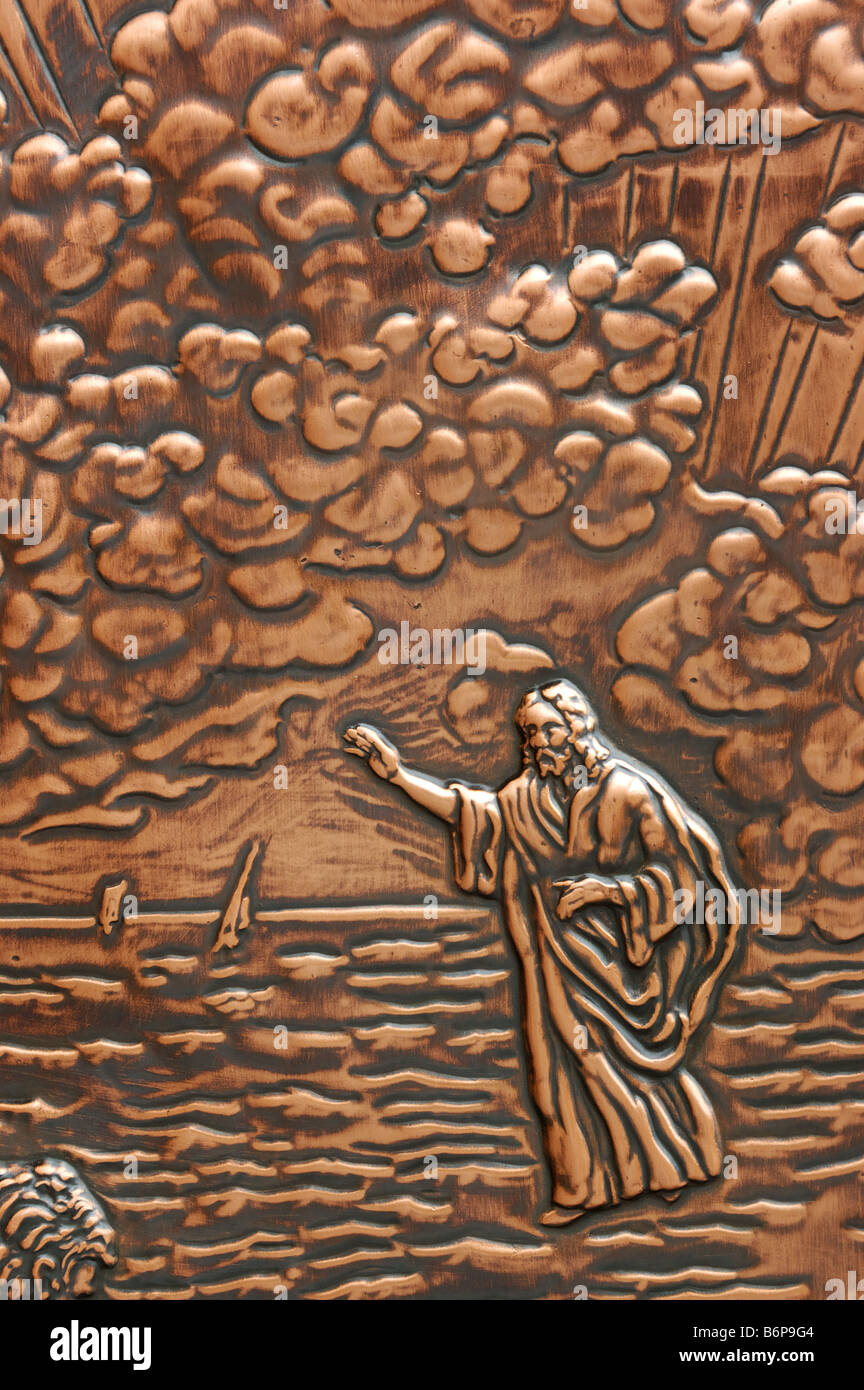 Biblical scenes in hammered copper on the doors of a cathedral in Quebec Stock Photo