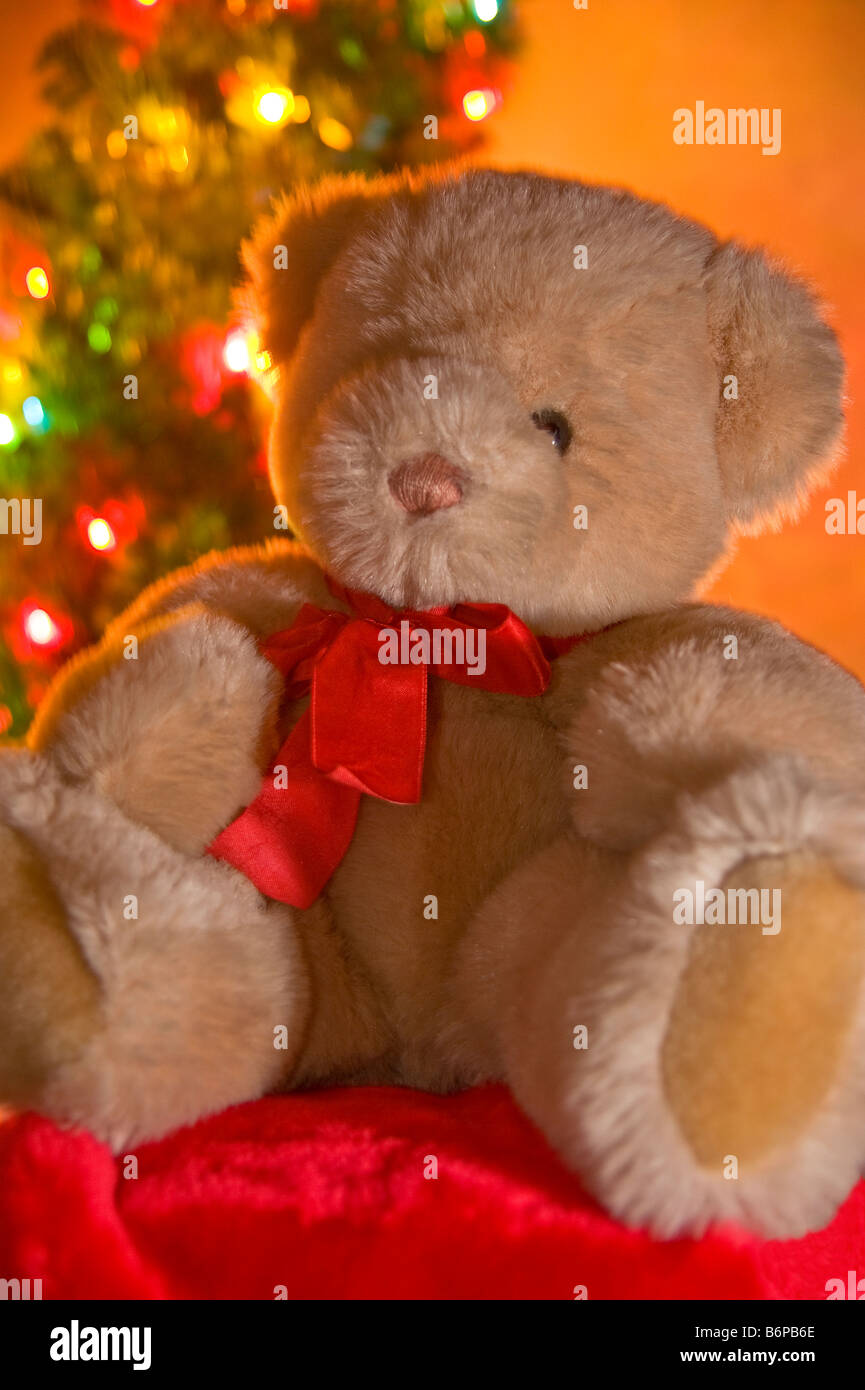 Teddy Bear in front of Christmas Tree Stock Photo - Alamy