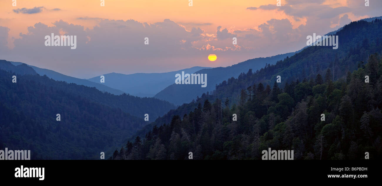 The sun illuminates the Blue Ridge Mountains in Great Smoky Mountain National Park at sunset at the Newfound Gap pull-off. Stock Photo