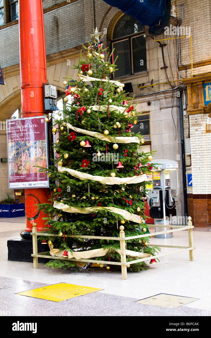 Christmas Xmas tree on station concourse Manchester Victoria station Stock Photo